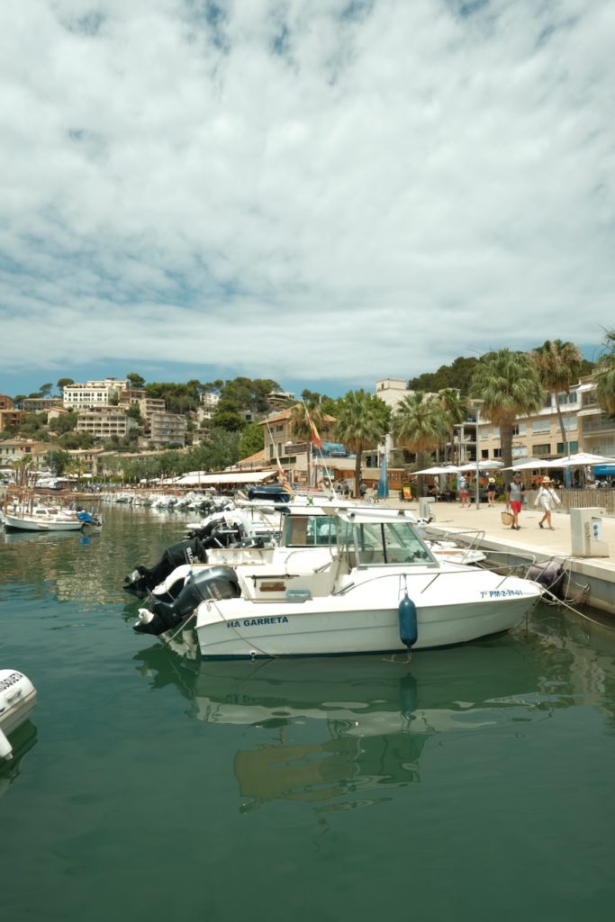 Scenic port with cloudy blue sky, a hidden gem Mallorca.