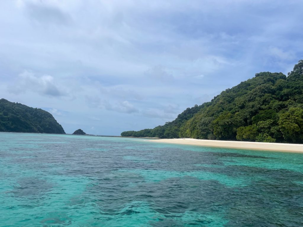 Crystal blue waters surrounding a pristine beach island off the coast of Koh Lanta.
