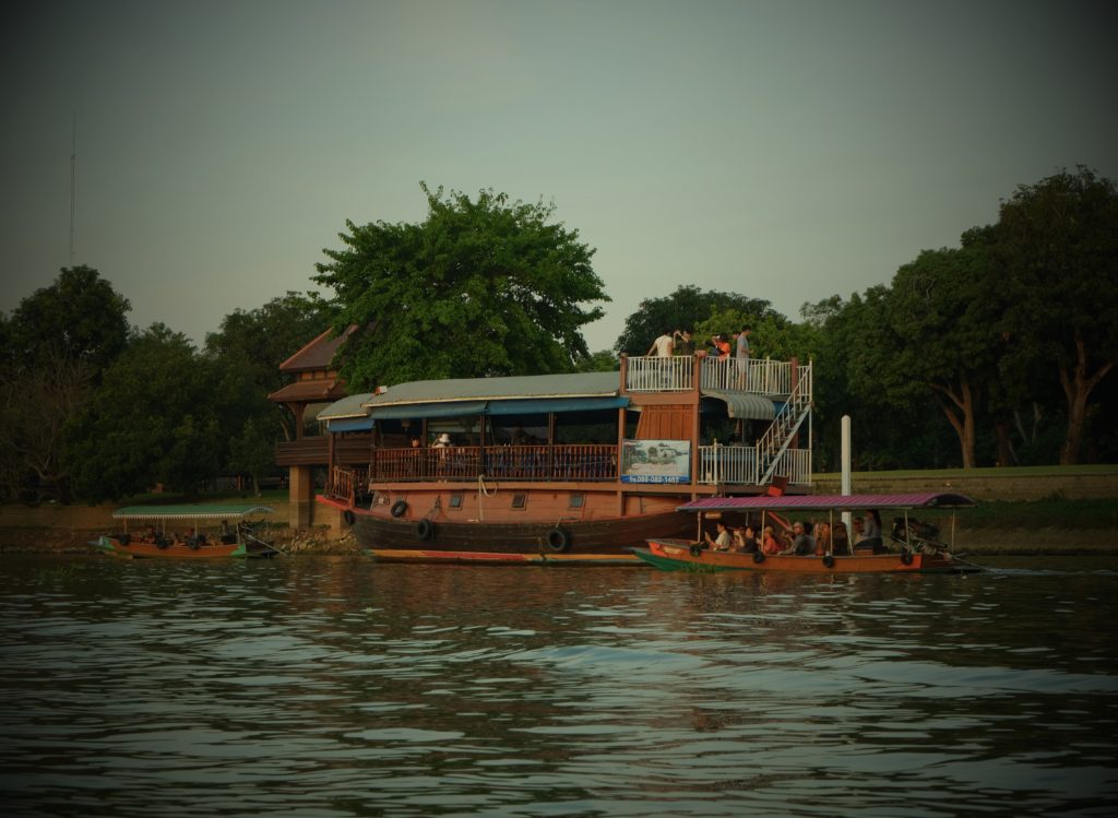 A unique boat situated on a local Thai river.