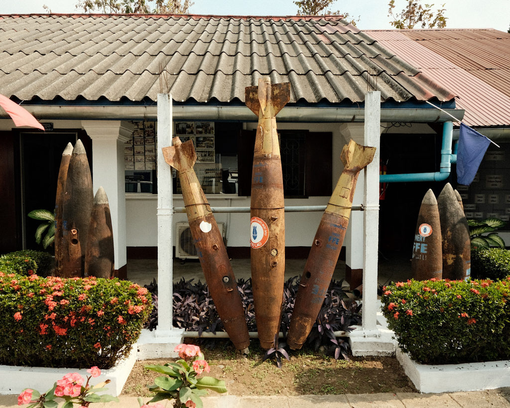 A collection of bomb remains showcased outside a museum.