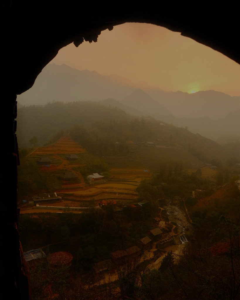 A scenic valley view at sunset.