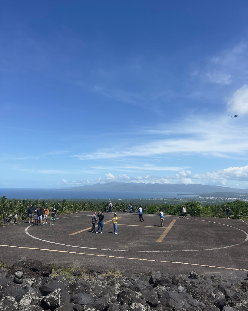 A helipad situated at the base of a volcano.