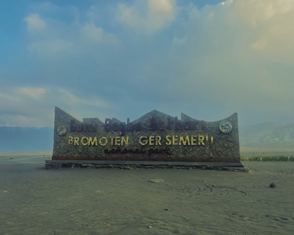 Sign at Bromo National Park situated at the black sea of sand