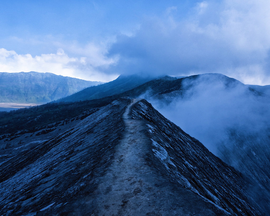 A volcanic crater hike engulfed with smoke.