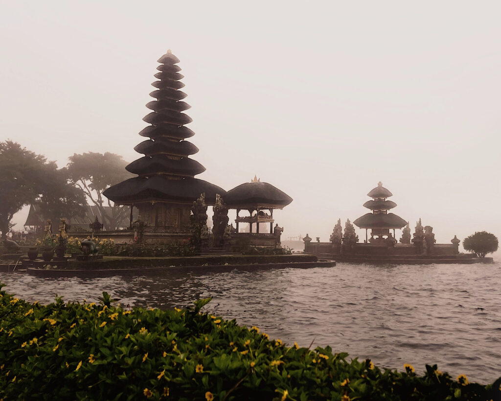 A misty day at a temple, serene atmosphere with fog surrounding the beautiful temple.